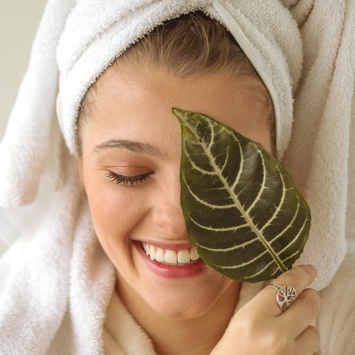 woman with leaf on face